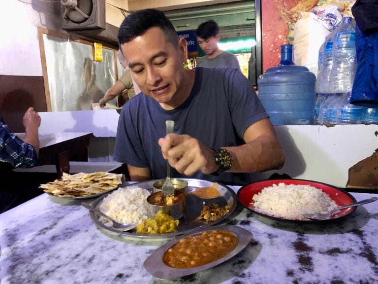 man eating Napal food