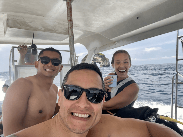 Friends smiling on boat in Bali